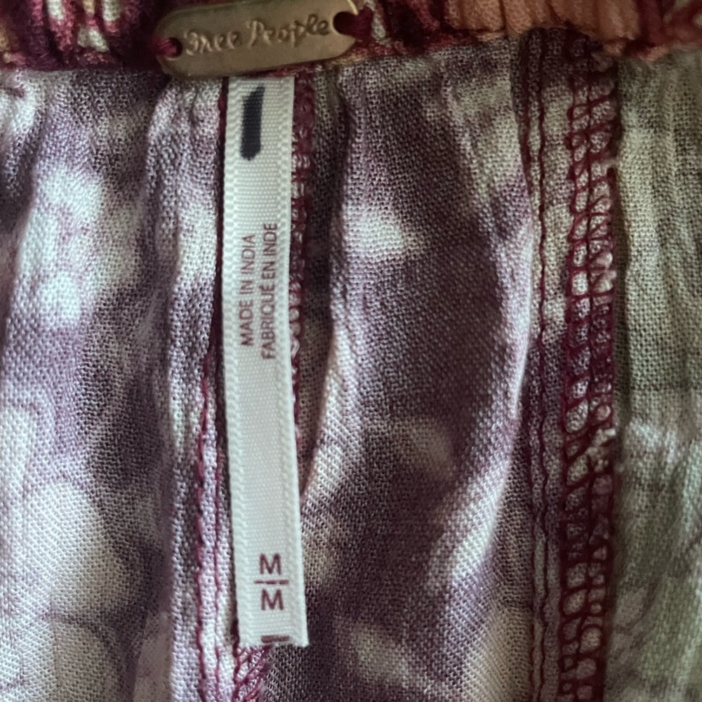 NWOT! Free People Bali Boho flare pants. Color multi reds and greens. Sizes: M,L - Picture 13 of 14